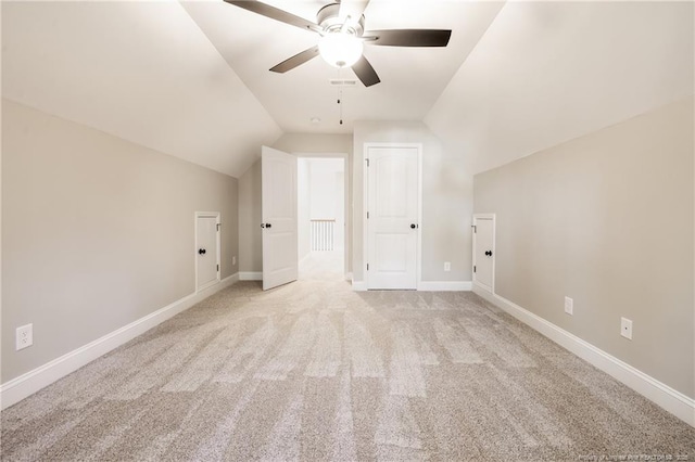 bonus room with ceiling fan, vaulted ceiling, and light carpet