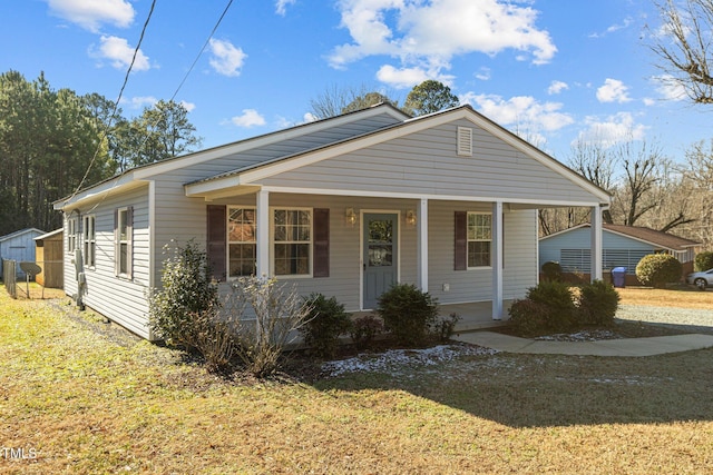 view of front facade with a porch and a front yard