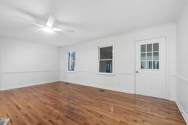 unfurnished room with ceiling fan, ornamental molding, and hardwood / wood-style floors