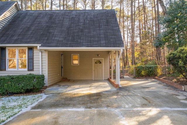 exterior space with a carport