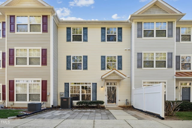 townhome / multi-family property featuring a patio area and central AC