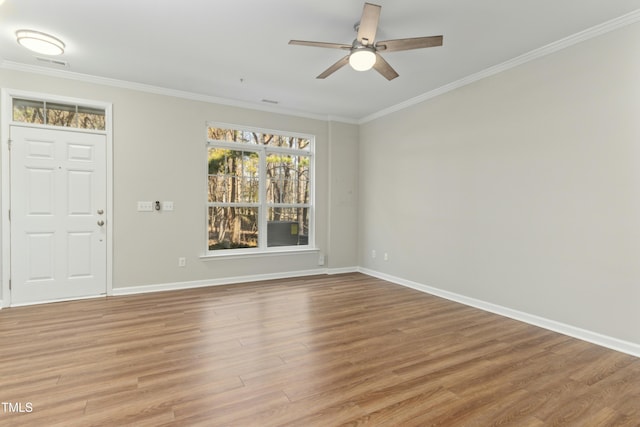 entryway with ceiling fan, light hardwood / wood-style flooring, and crown molding