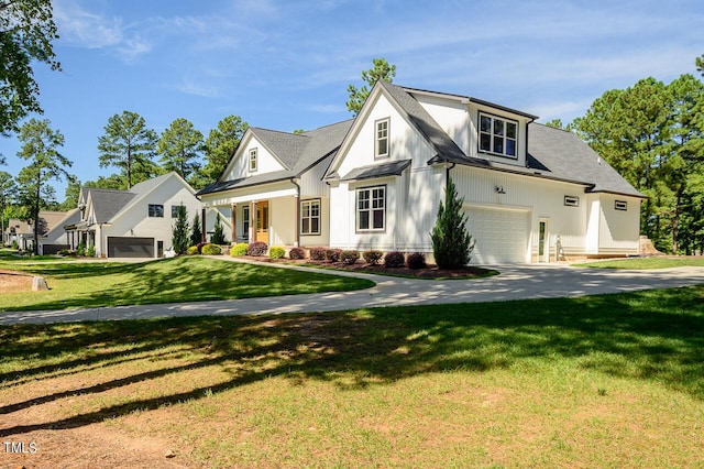 view of front of property with a garage, a front lawn, and covered porch