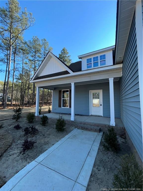 entrance to property with a porch