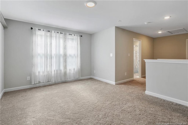 empty room featuring light colored carpet