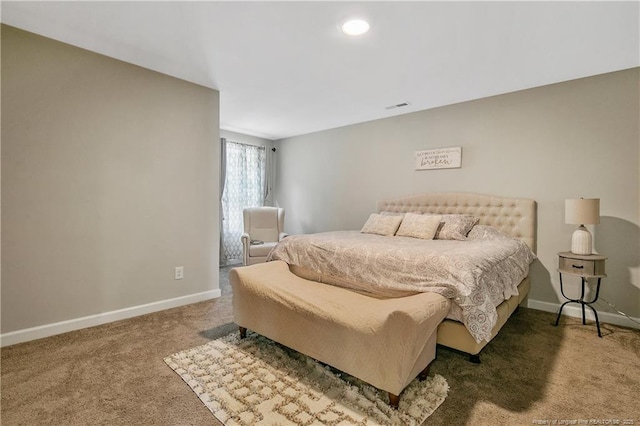 bedroom with dark carpet