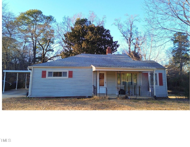 ranch-style house with a carport and a porch