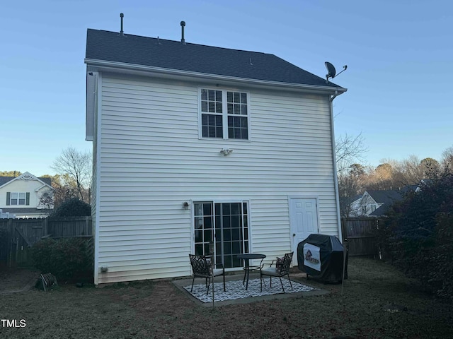 rear view of house with a patio