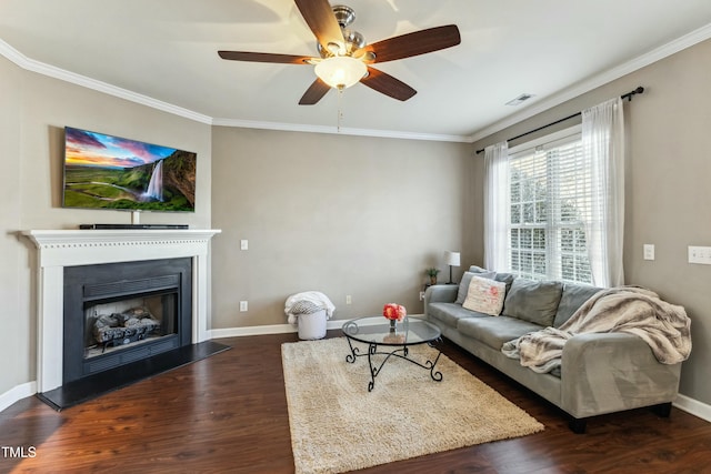 living room featuring ceiling fan, dark hardwood / wood-style floors, and crown molding