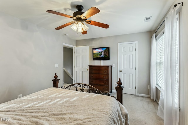 bedroom featuring ceiling fan and light colored carpet