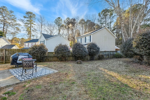 view of yard with a patio area and an outdoor fire pit