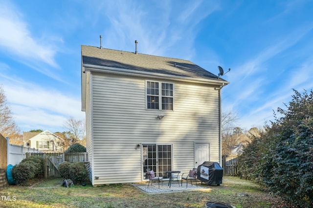 back of property with a patio area