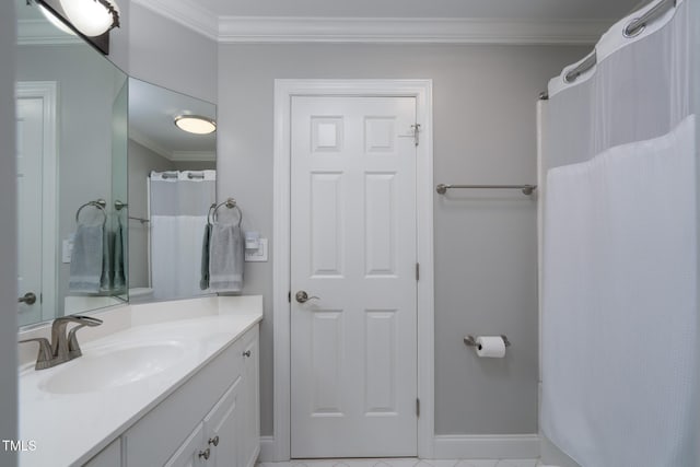 bathroom with vanity, tile patterned flooring, and crown molding