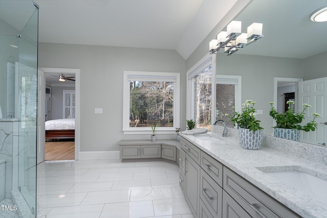 bathroom featuring walk in shower, vanity, and tile patterned floors