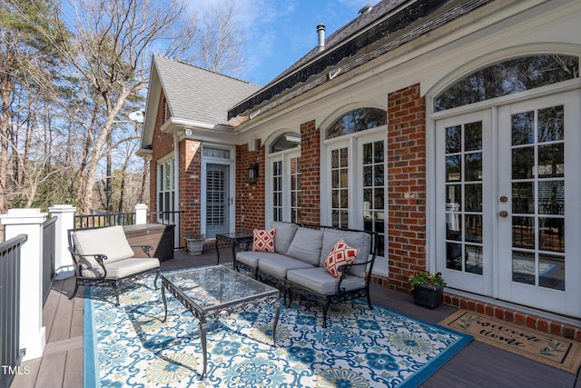 deck featuring an outdoor hangout area and french doors