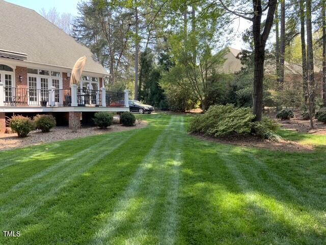 view of yard with a wooden deck