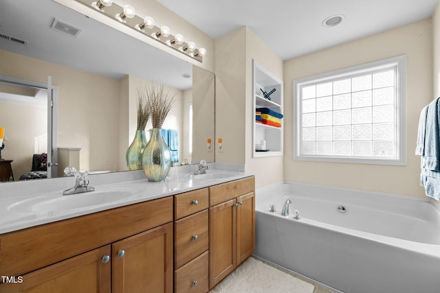 bathroom featuring vanity and a washtub