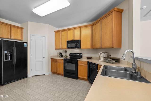 kitchen with sink and black appliances