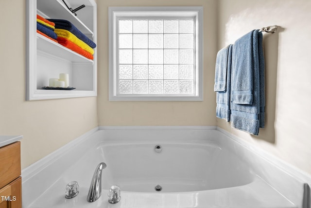 bathroom with vanity and a bathing tub