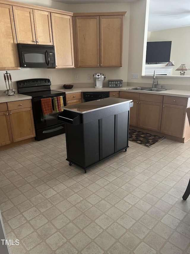 kitchen with sink and black appliances