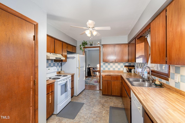 kitchen featuring ceiling fan, sink, white appliances, and tasteful backsplash