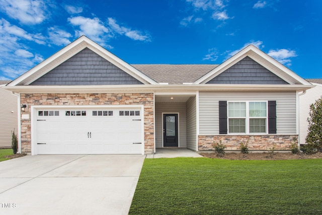 craftsman inspired home featuring a front yard and a garage