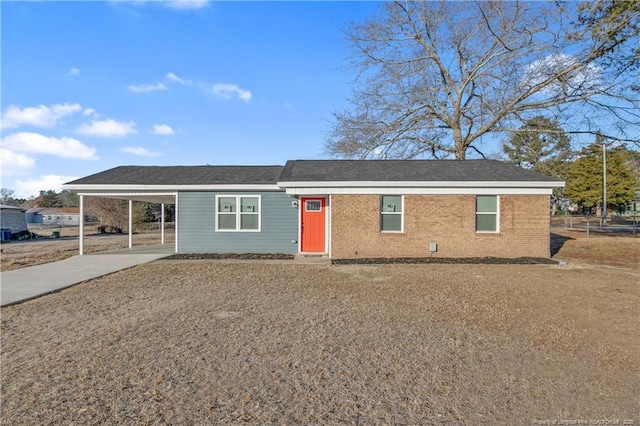 ranch-style house with a carport