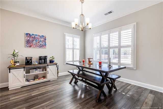 dining space with ornamental molding, dark hardwood / wood-style floors, and a chandelier