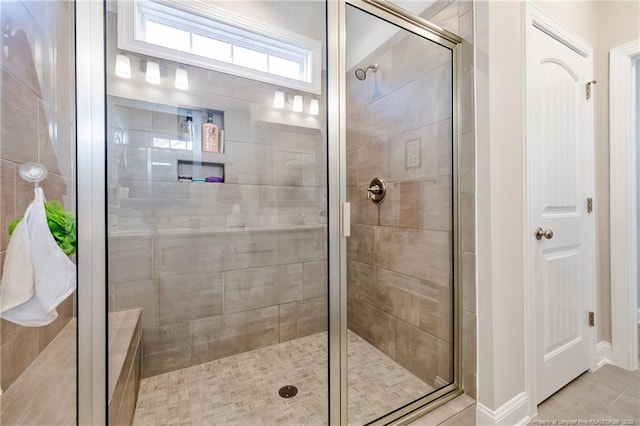 bathroom featuring an enclosed shower