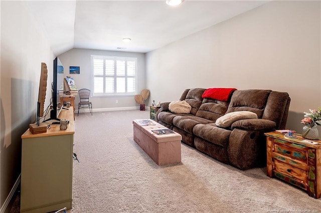 carpeted living room with lofted ceiling