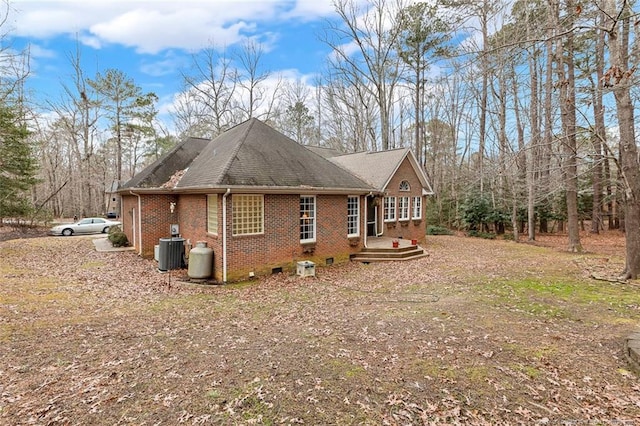 view of side of property with central AC unit