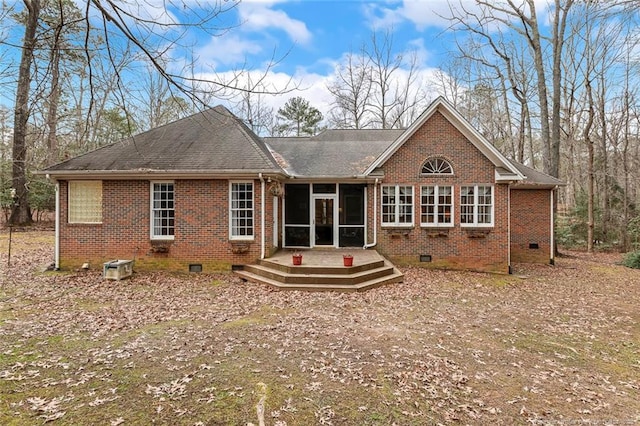 back of property featuring a sunroom