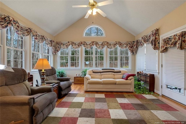 sunroom with vaulted ceiling, ceiling fan, and a wealth of natural light