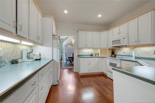 kitchen featuring white cabinetry, backsplash, white appliances, and dark hardwood / wood-style floors