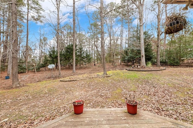 view of yard featuring a wooden deck