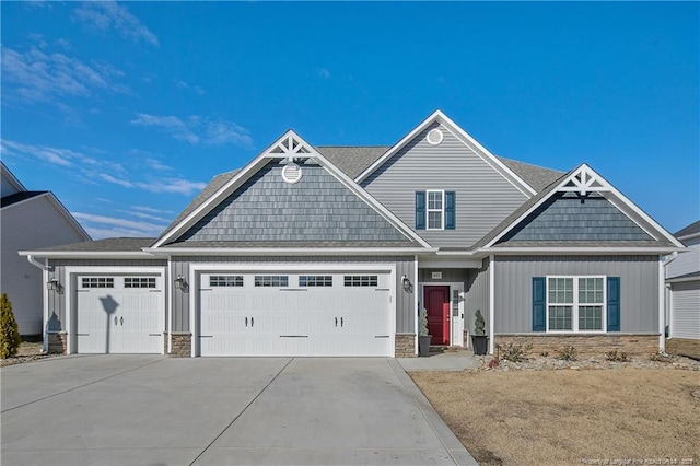 craftsman-style home featuring a front yard and a garage