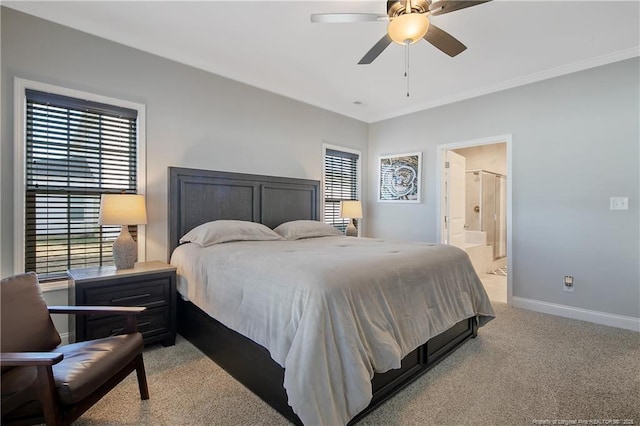 bedroom featuring ceiling fan, light colored carpet, ensuite bathroom, and ornamental molding