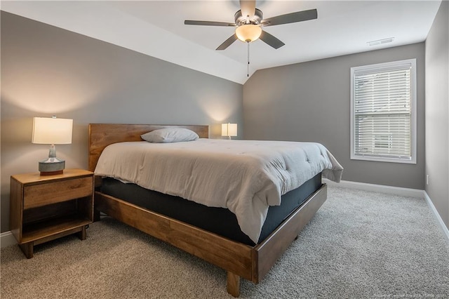 carpeted bedroom with ceiling fan and lofted ceiling