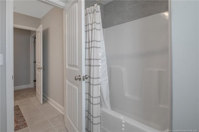 bathroom with tile patterned floors and shower / bath combination with curtain