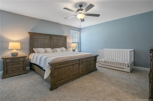 bedroom featuring ceiling fan and light carpet