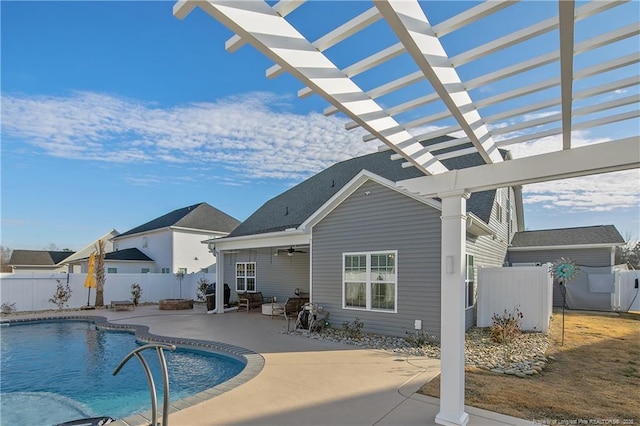 view of swimming pool featuring a patio area, ceiling fan, and a pergola