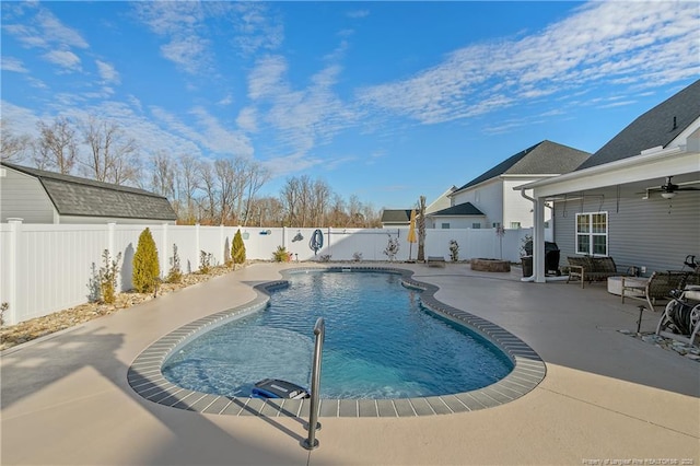 view of swimming pool with ceiling fan, grilling area, and a patio