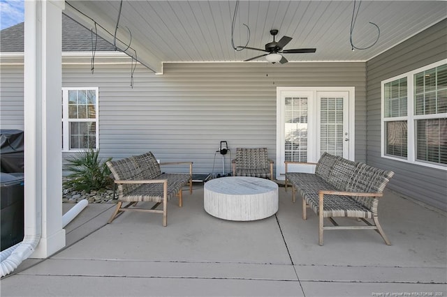 view of patio featuring ceiling fan and an outdoor living space