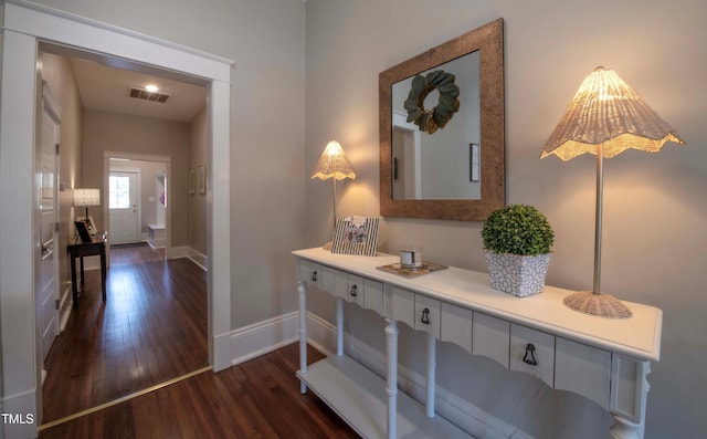 hallway with dark hardwood / wood-style floors