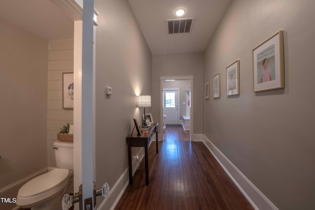 hallway with dark wood-type flooring