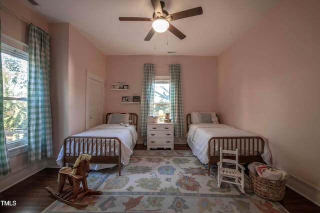 bedroom with ceiling fan and hardwood / wood-style floors