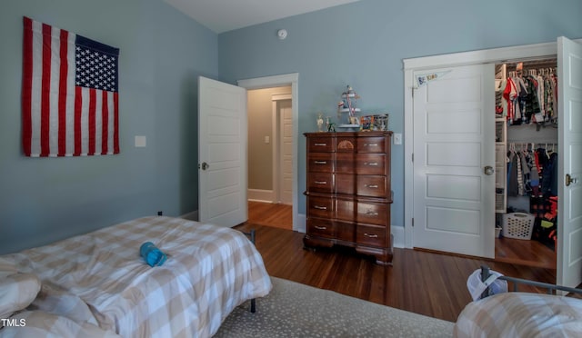 bedroom featuring a closet and dark hardwood / wood-style flooring