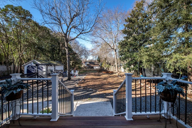 wooden deck featuring a storage shed