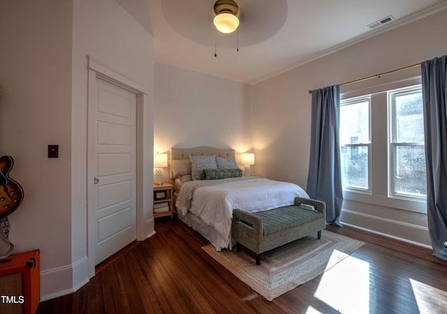 bedroom with ceiling fan and dark wood-type flooring