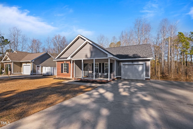 ranch-style house with a garage and a porch